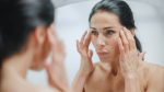 Caucasian Woman Looking in Mirror