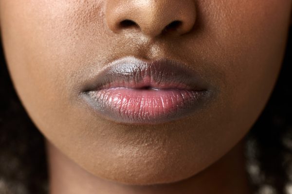 Close-up image of young african woman lips