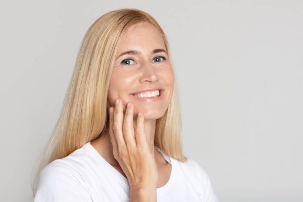 woman smiling after mesotherapy