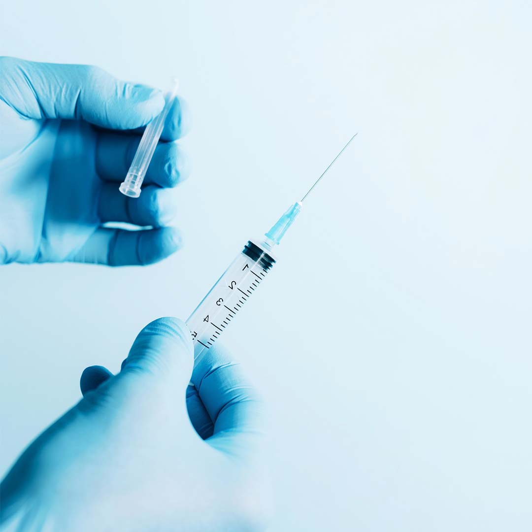 Doctor holding Injection