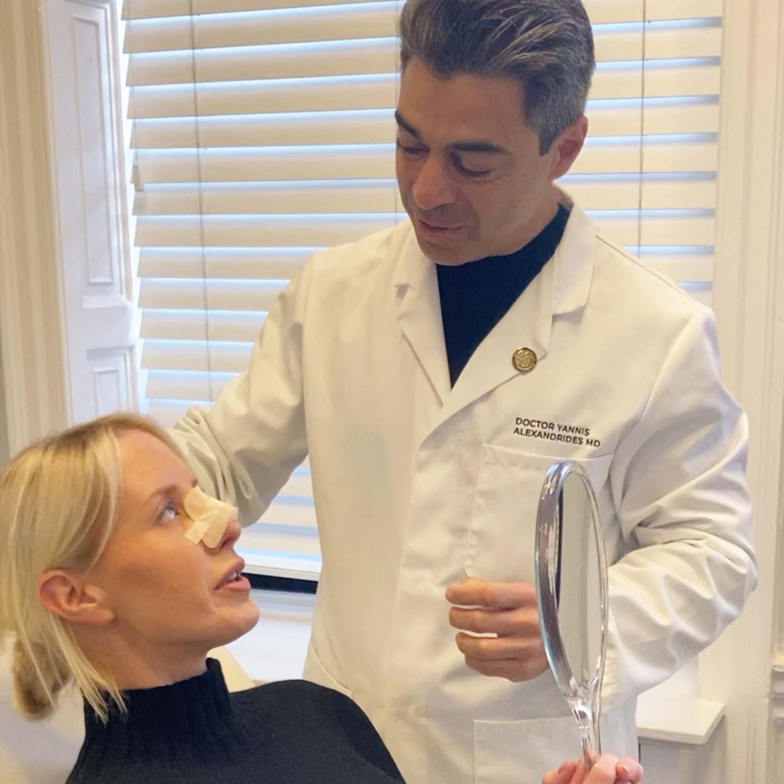 A woman is looking up at her doctor a few weeks after her nose surgery
