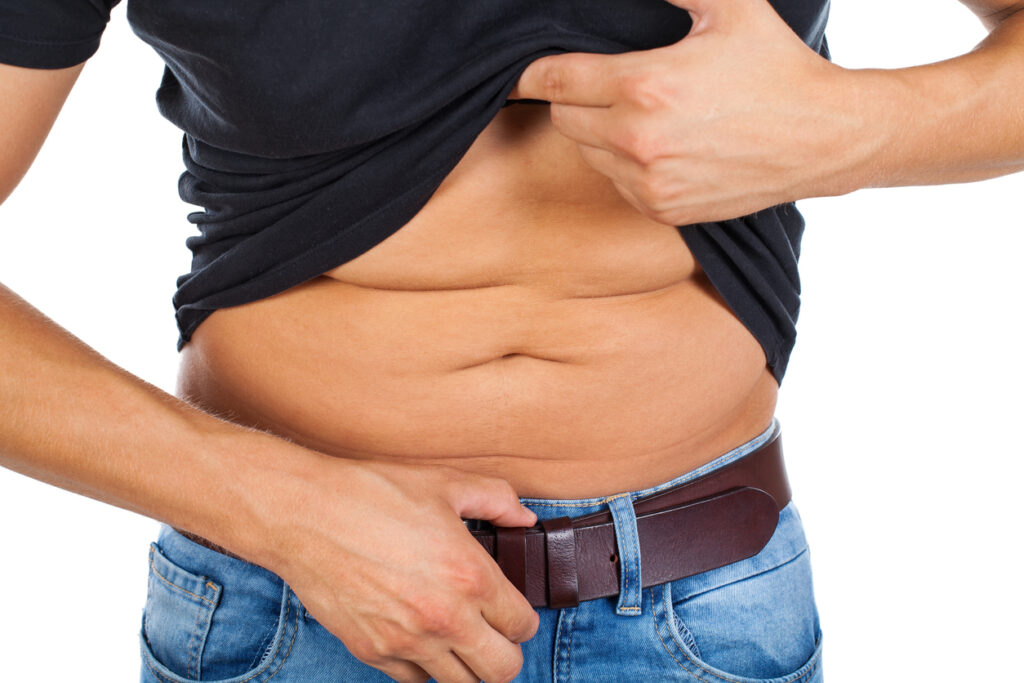 Person pinching abdominal fat