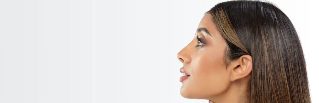 Side profile of woman highlighting refined nasal contours