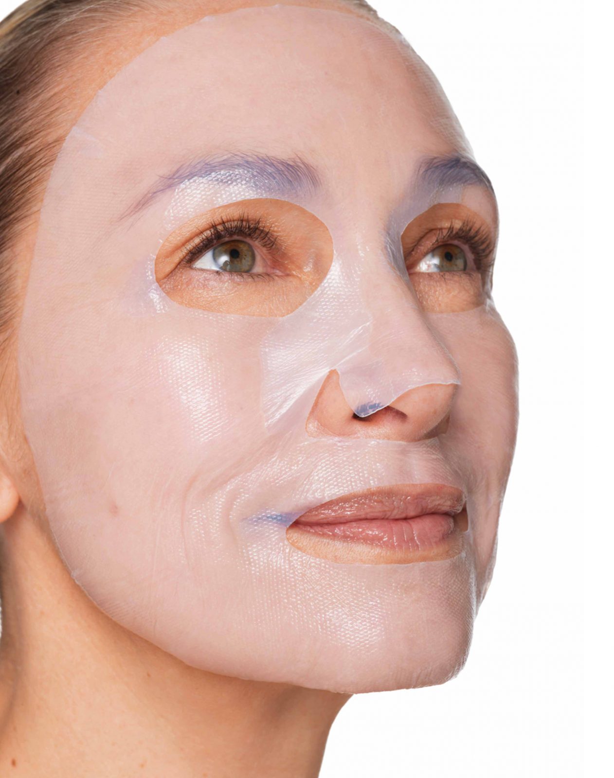A woman is wearing a skincare face mask