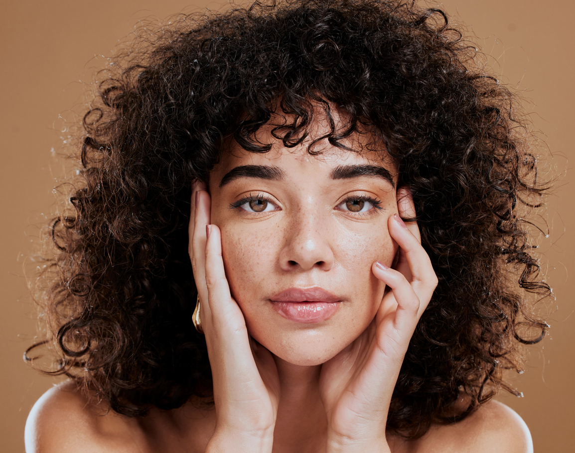Woman, hands on face and afro hair