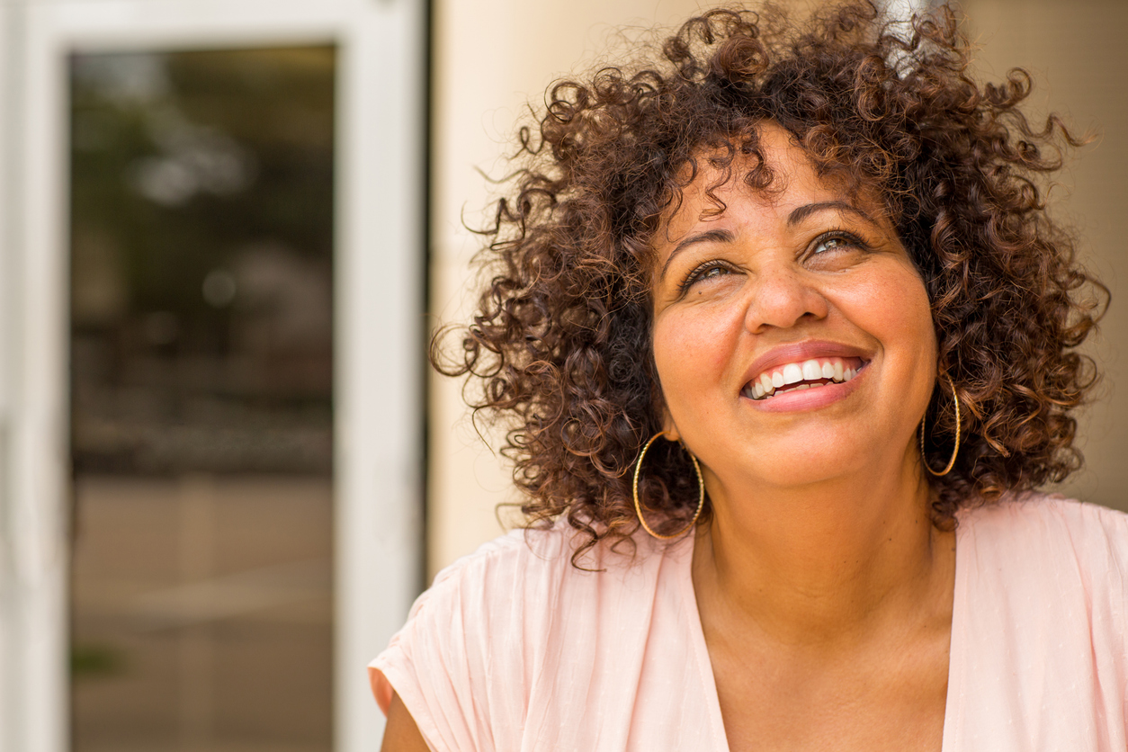 Portrait of a mature woman laughing.