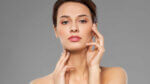 a Woman touching her face showing