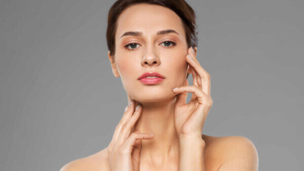 a Woman touching her face showing