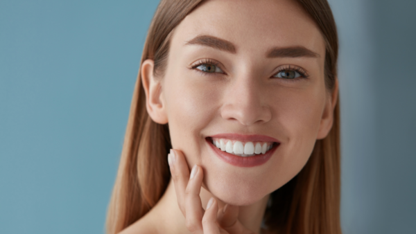 Portrait of a woman with flawless teeth and glowing skin