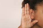 Detailed close-up of a person’s ear area